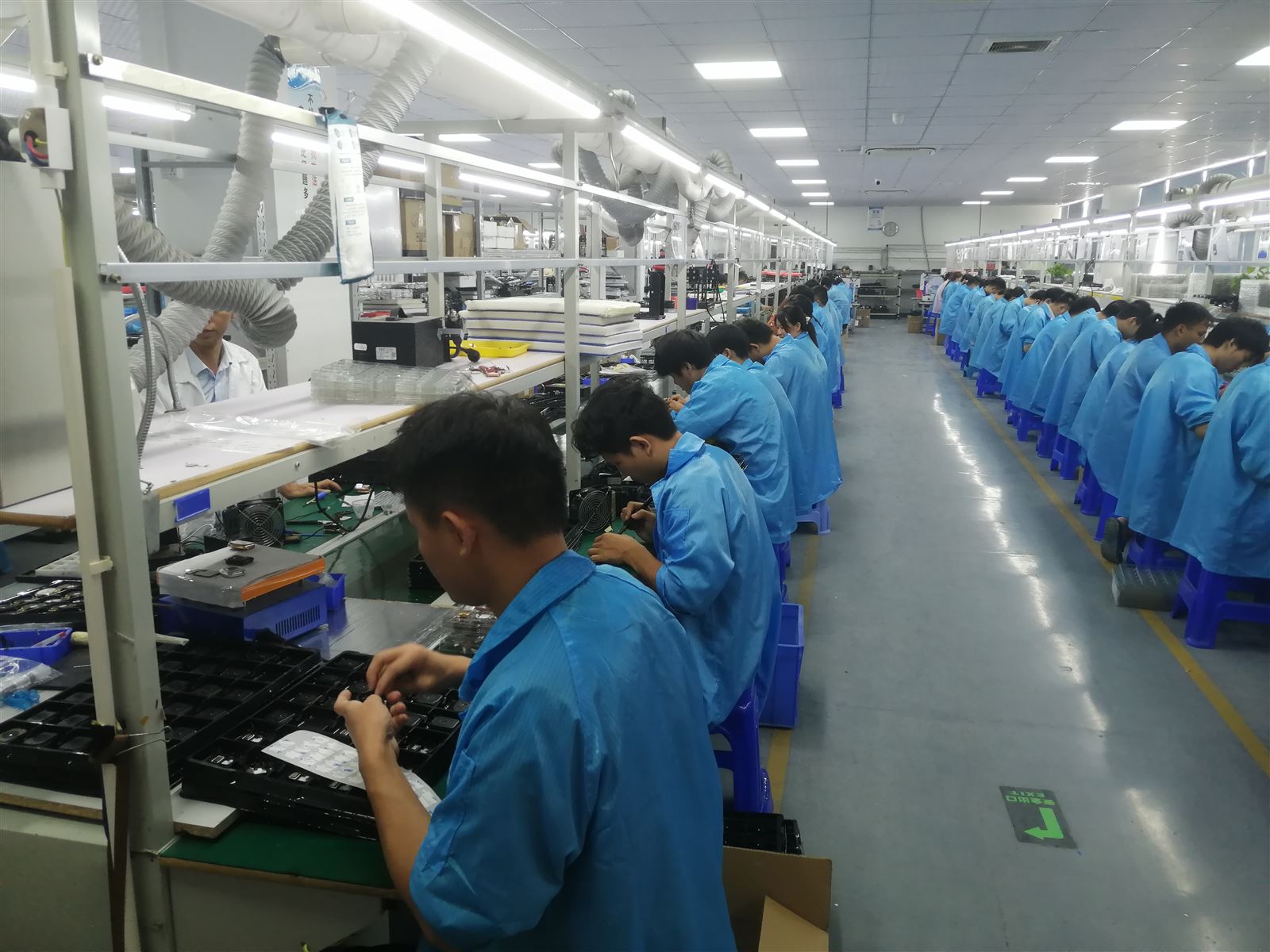 EngraSun factory — seated operators along the production line