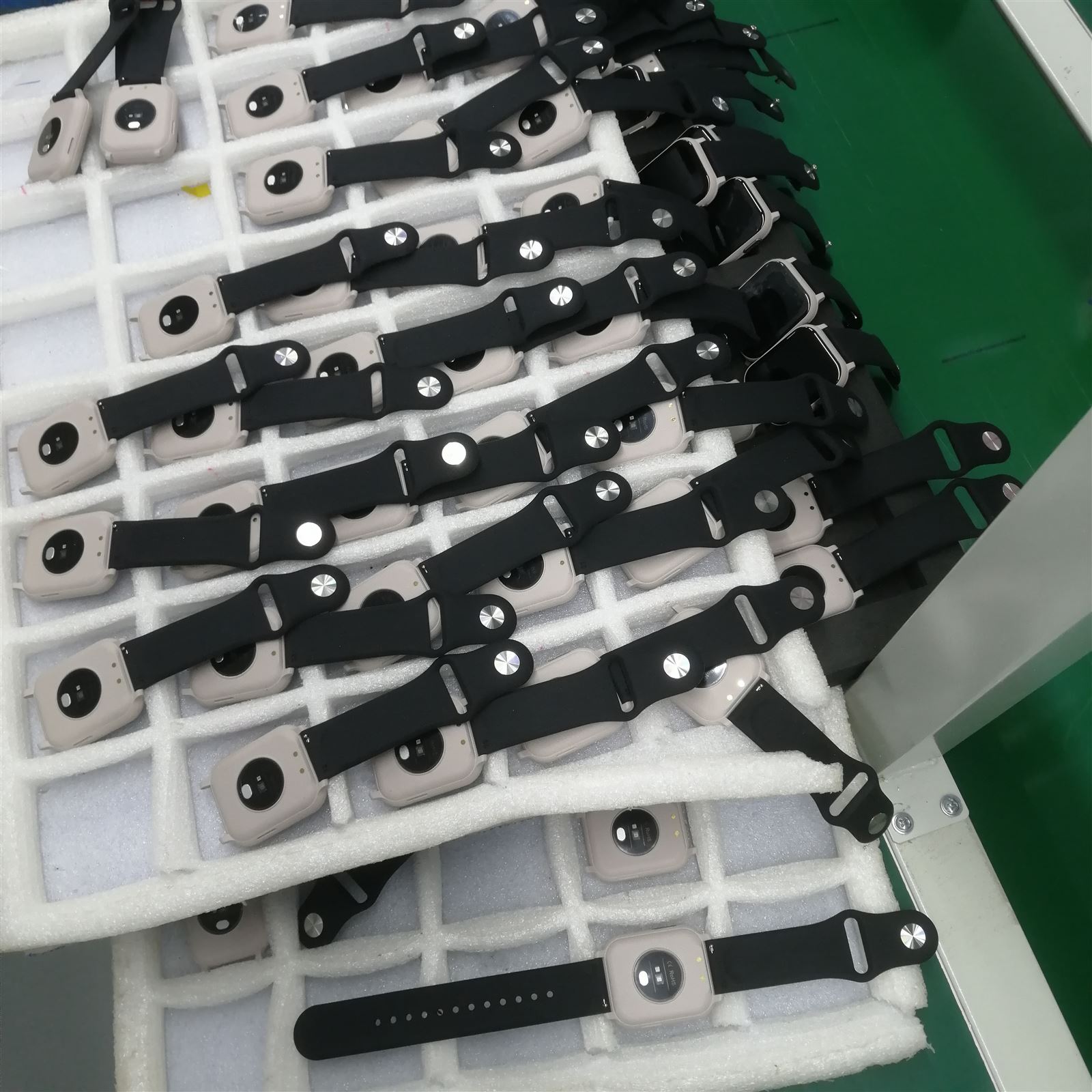 EngraSun factory — batch of finished watches in foam trays