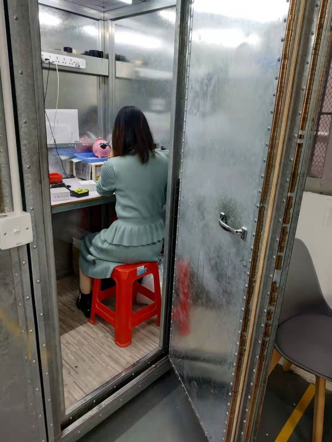 EngraSun factory — operator inside a shielded test chamber